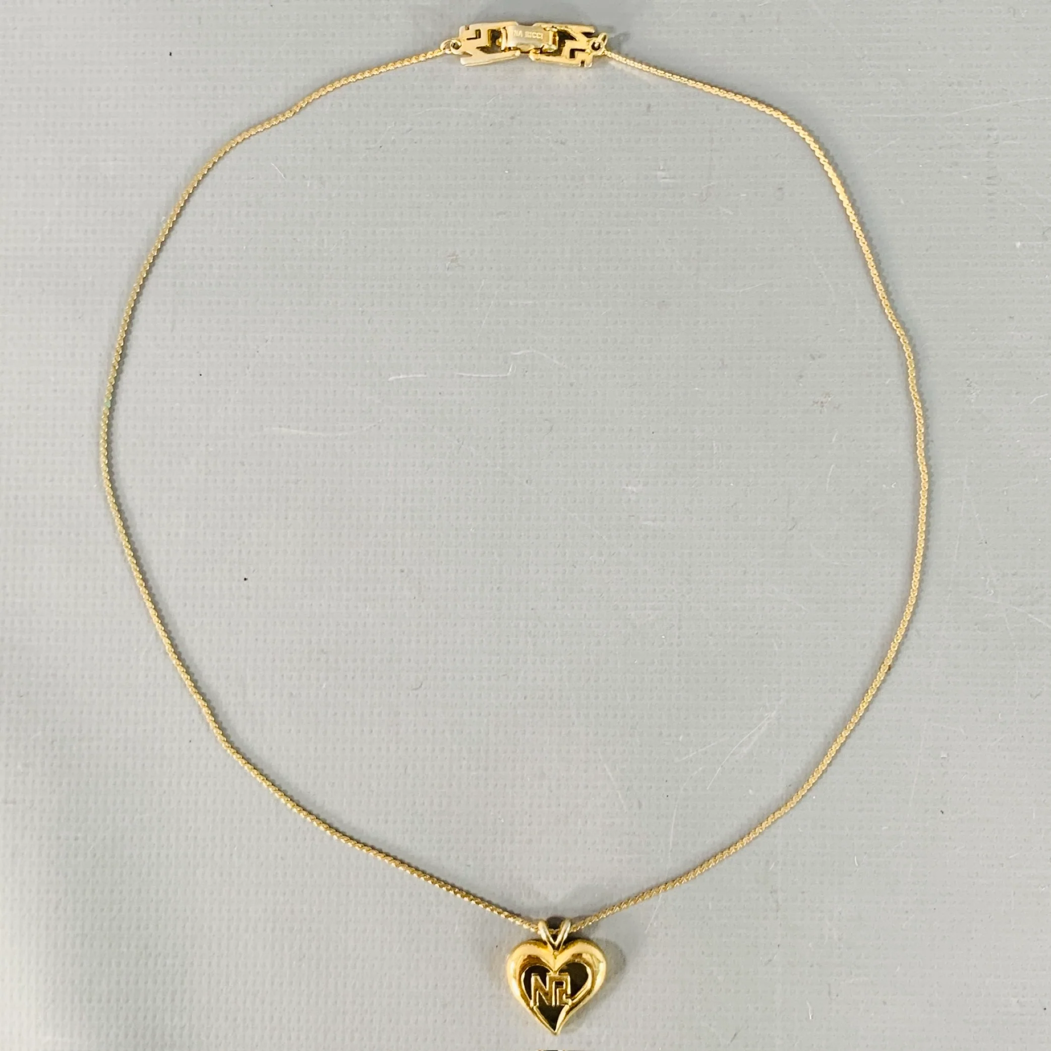 NINA RICCI Gold Metal Heart Monogram Pendant Necklace